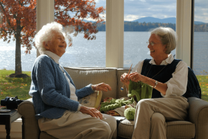 Two senior aged friends laughing